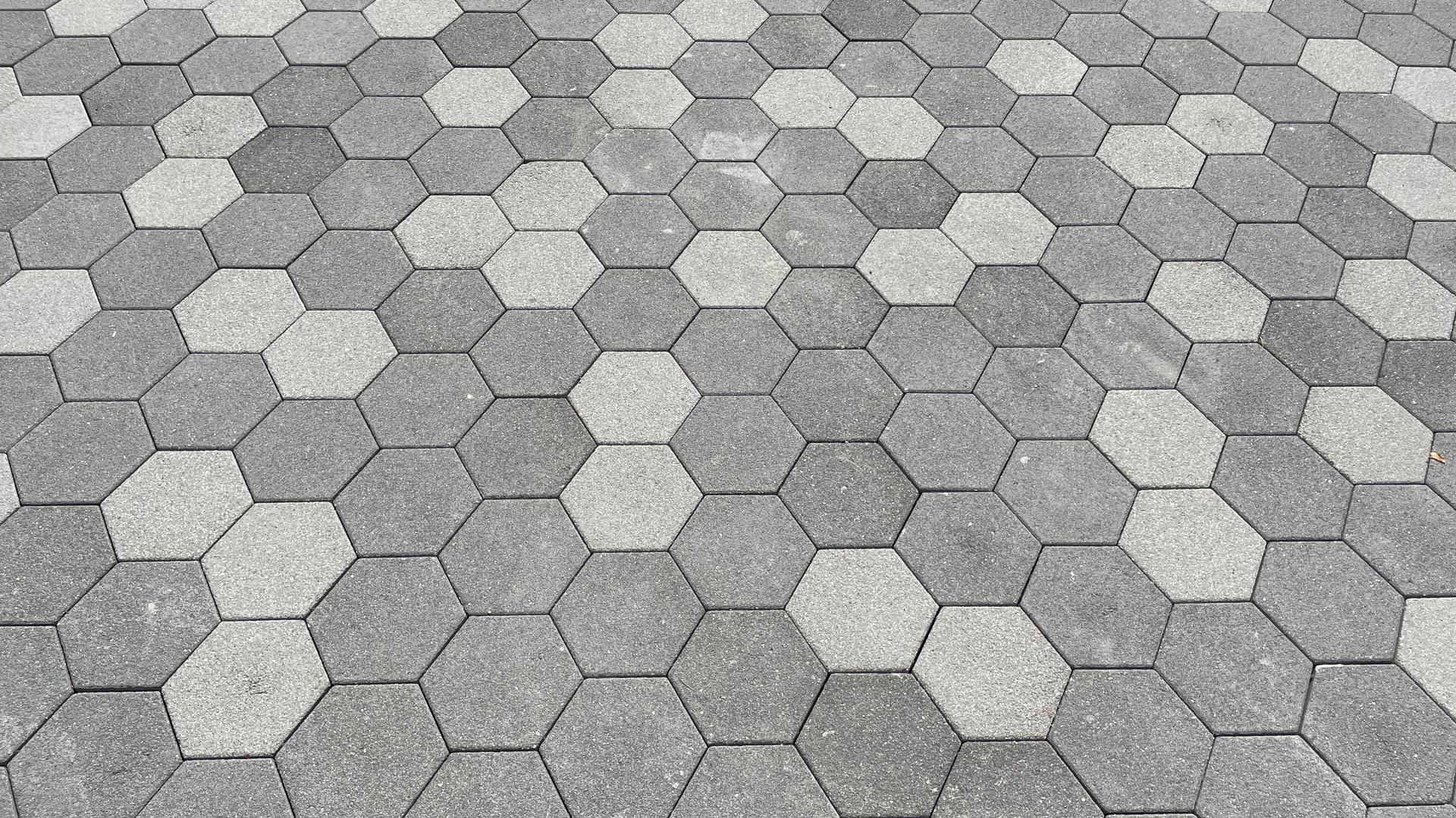 Pattern of gray hexagonal pavers with a slightly textured, sparkly finish.